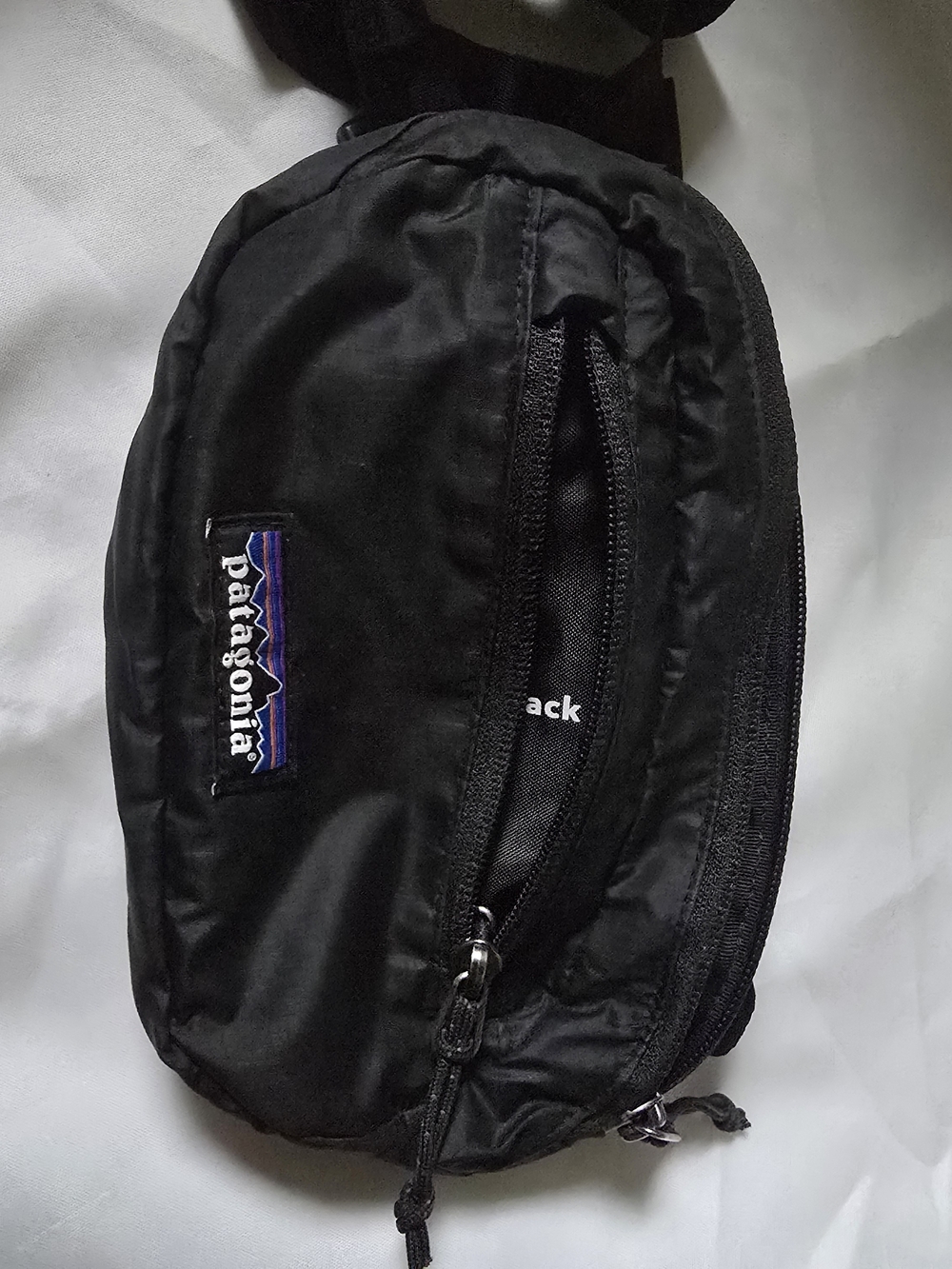 Patagonia Black Crossbody Waist Pack with Purple Logo